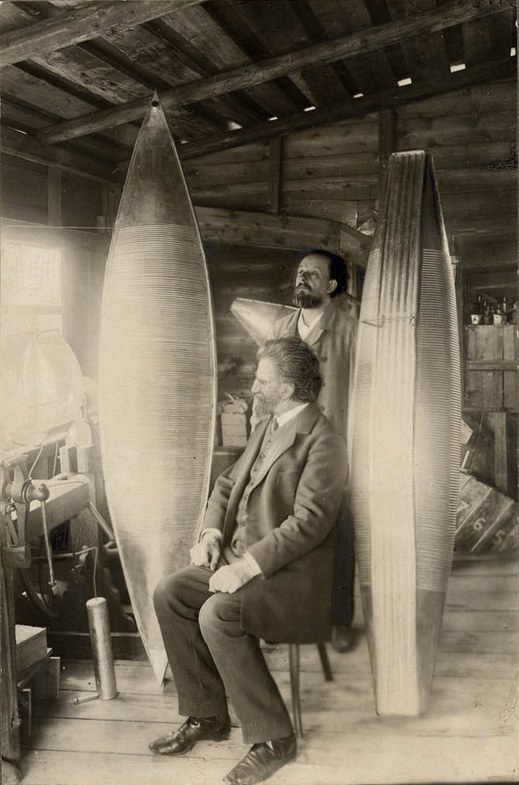 Tsiolkovsky K. E. and Assonov V. I. with models of the airship shell of the design of K. E. Tsiolkovsky of the 1912-1913 model in the scientist's workshop. Photographer: Assonov Oleksandr Vasilyevich.